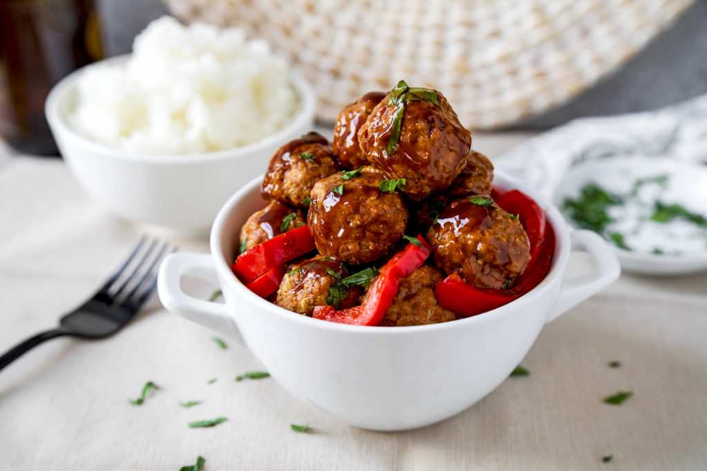 bowl of Cajun meatballs with red bell peppers