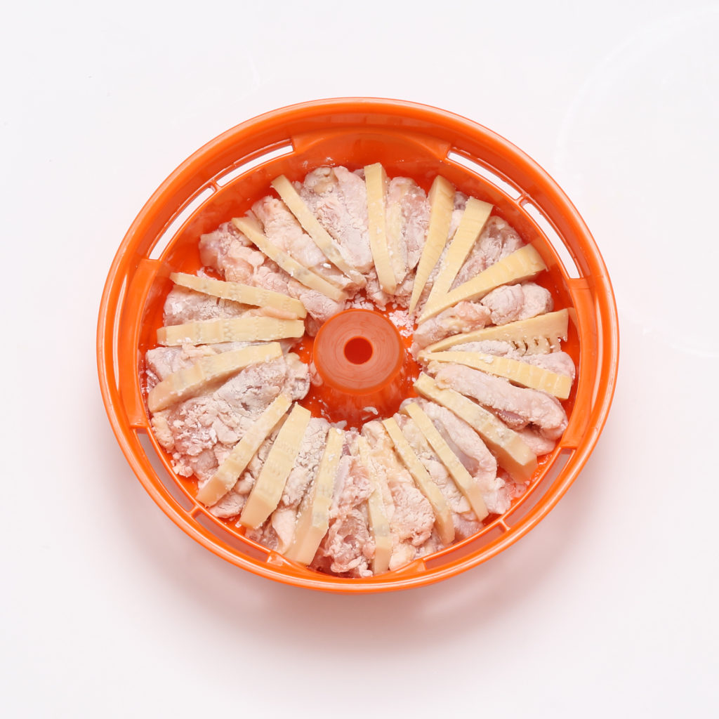 sliced chicken and bamboo shoots in Tacook steam tray - Tiger rice cooker