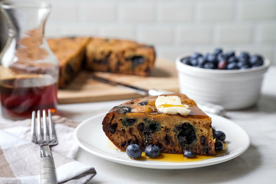 Giant rice cooker pancake slice with blueberries and syrup